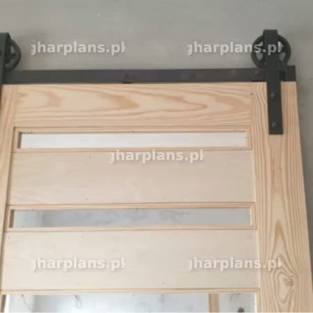 Partially Installed Wooden Sliding Door on a Metal Rail System