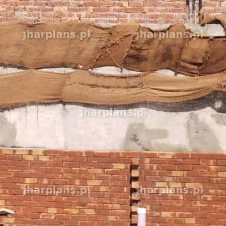 Layering of Brick Wall and Curing in Progress