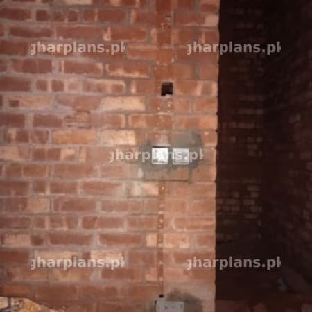Brick Wall with Electrical Wiring Installation in Progress