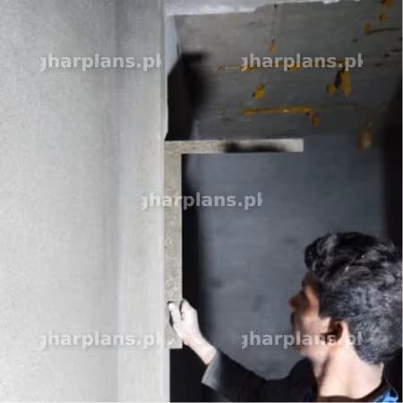 Worker Checking the Right Angle of a Wall Using Steel Square
