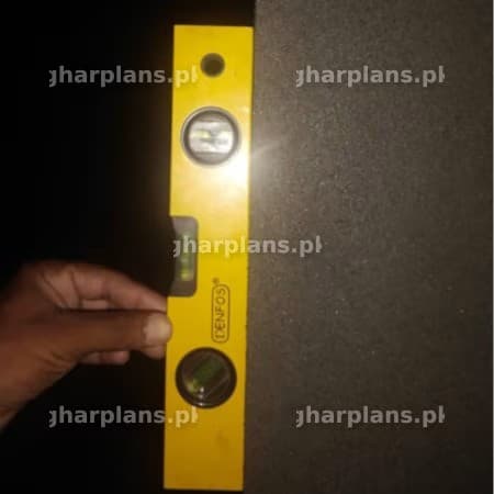 Checking if Surface is Vertically Leveled Using a Spirit Level Tool