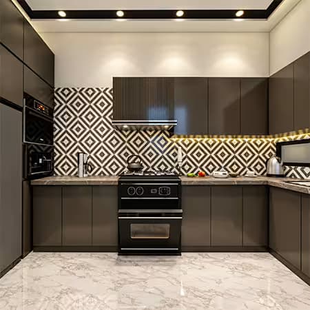 Modern U-shaped kitchen featuring dark cabinets, geometric patterned backsplash, marble flooring, built-in appliances, countertop sink, cooking range, and warm recessed lighting.