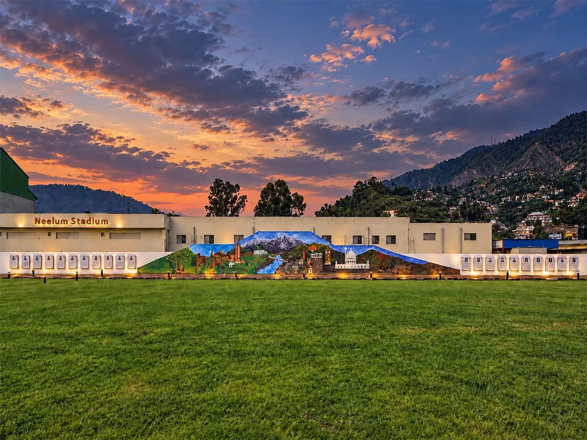 Heritage mural at Kashmir Lounge Museum depicting Neelum Stadium and mountain scenery from Azad Kashmir's Neelum Valley region