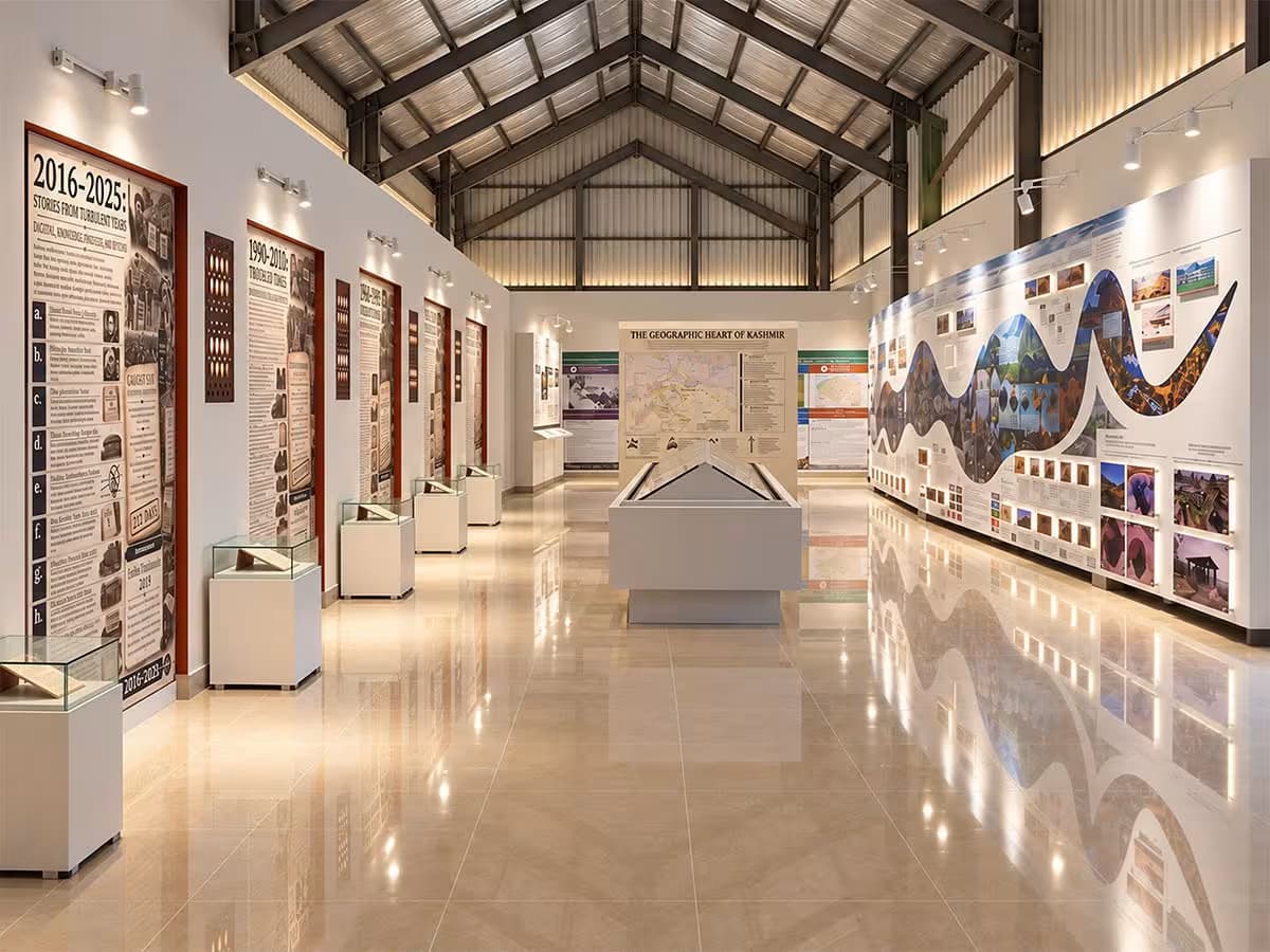 Interior exhibition gallery at Kashmir Lounge Museum with historical displays, information panels and museum lighting