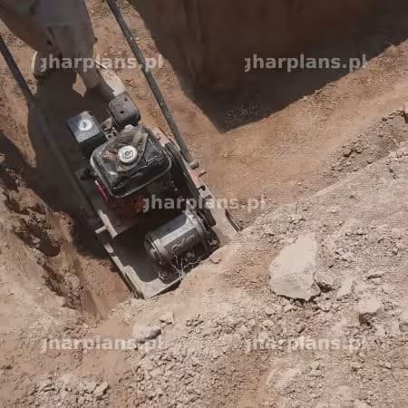 Compaction work of foundations of house through compactor Compaction work of foundations of house through compactor